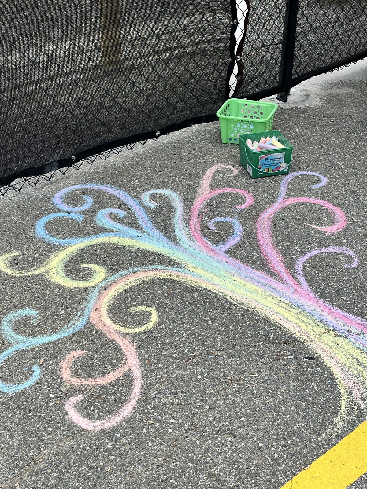Colourful sidewalk chalk art created by children