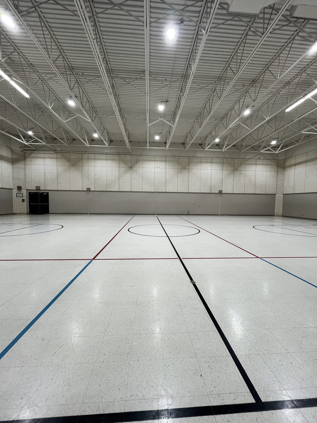 The full-size indoor gymnasium used for gymnastics, dance, and music classes