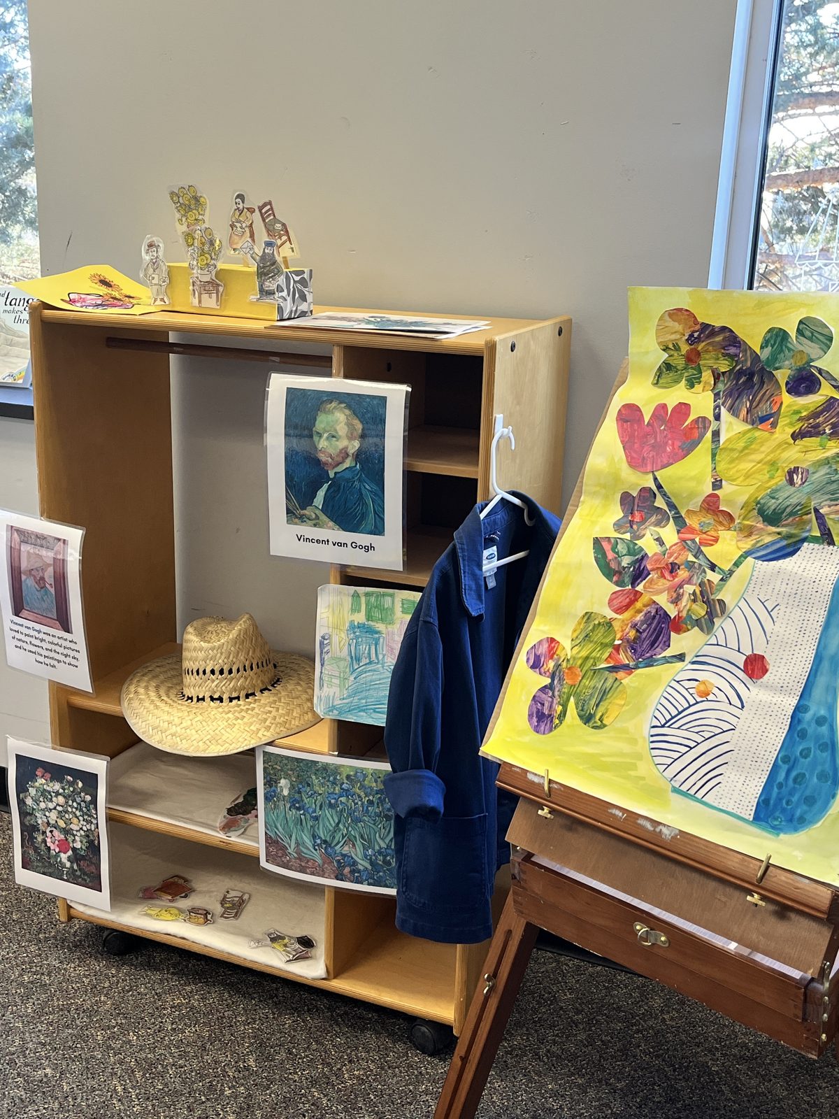 A Van Gogh artist study with reference paintings and a child's sunflower painting